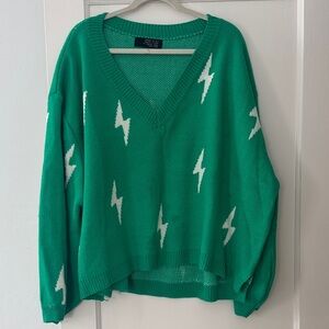 Dressed in LALA Green V-Neck Sweater with White Lightning Bolts